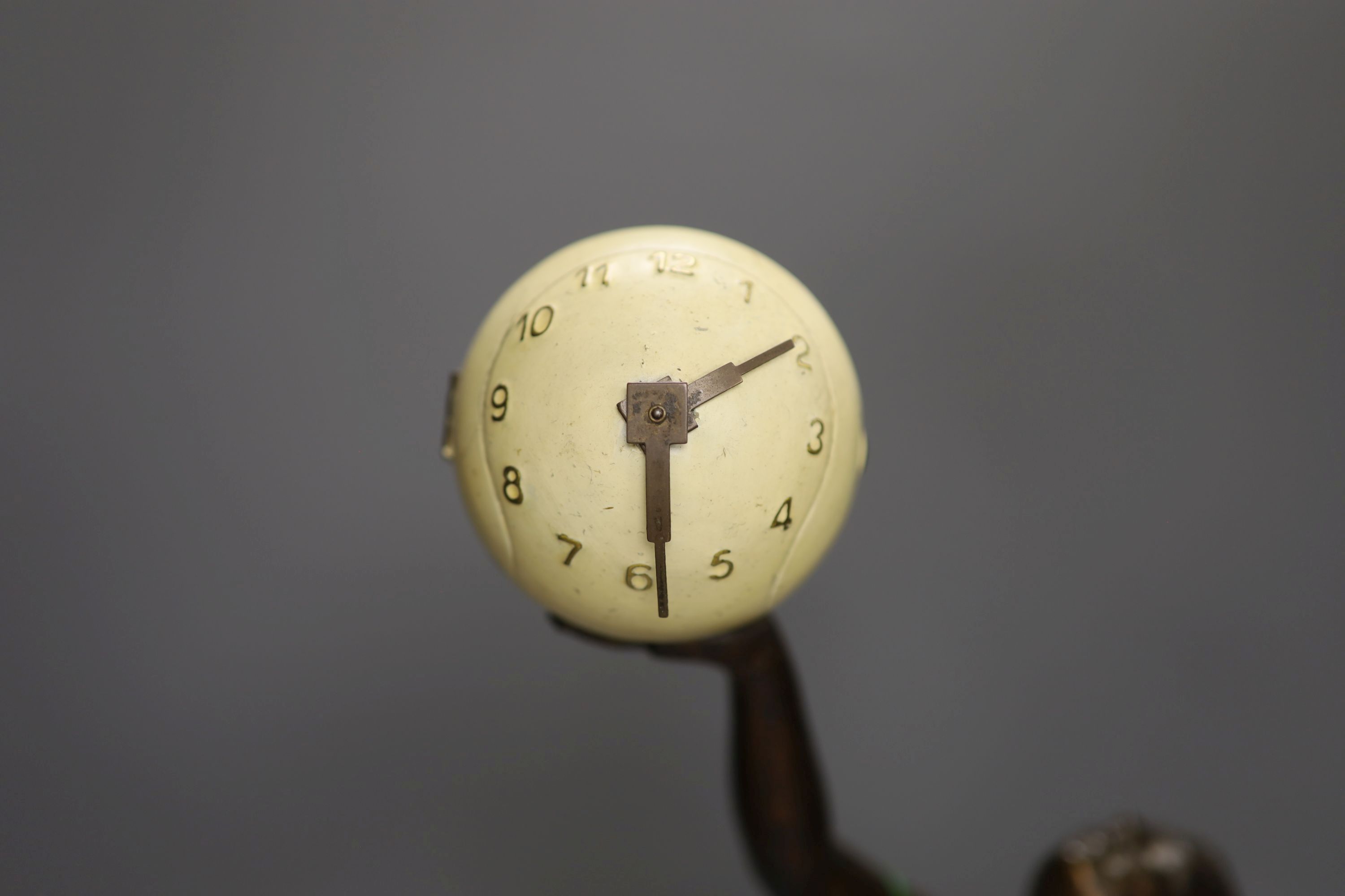 An Art Deco style spelter and onyx figural timepiece, height 56cm